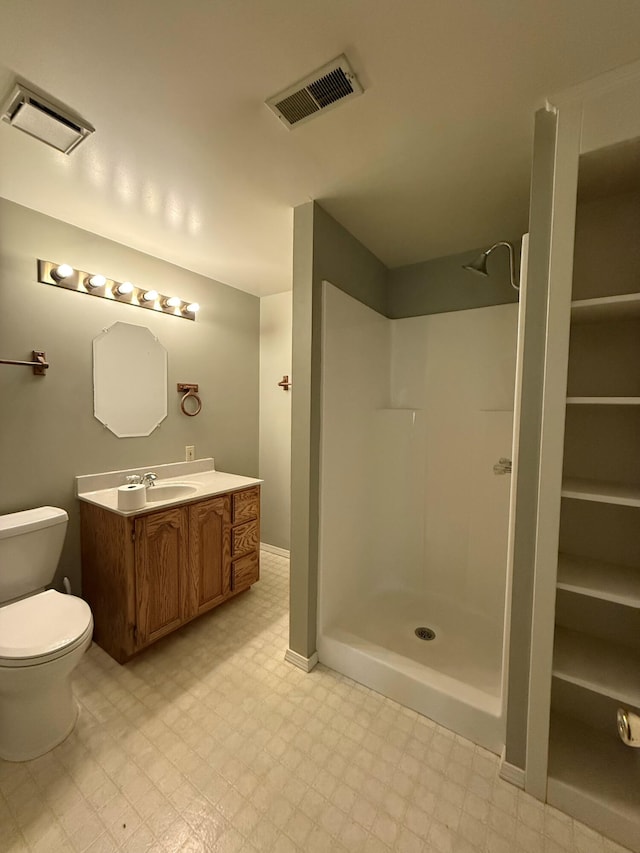 16709 Honeysuckle Hill Rd, Eminence, MO 65466 - full bath with tile patterned floors, a shower, toilet, and vanity