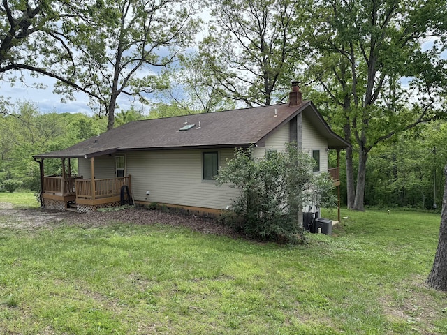 16709 Honeysuckle Hill Rd, Eminence, MO 65466 - view of side of property with a chimney, a deck, a yard, and roof with shingles