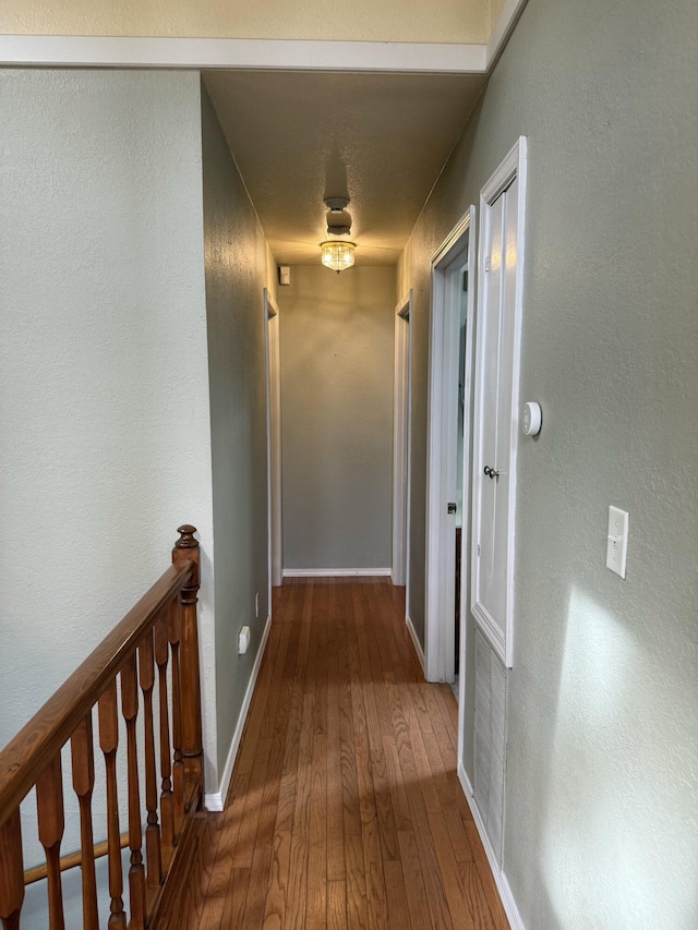 16709 Honeysuckle Hill Rd, Eminence, MO 65466 - corridor featuring hardwood / wood-style floors, an upstairs landing, and baseboards