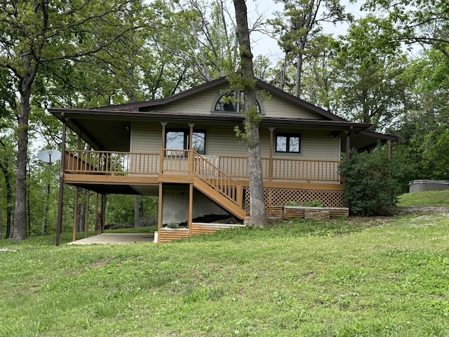 16709 Honeysuckle Hill Rd, Eminence, MO 65466 - back of property with a porch, a lawn, stairway, and a carport