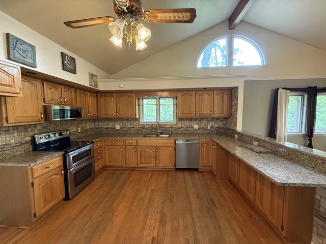 16709 Honeysuckle Hill Rd, Eminence, MO 65466 - kitchen featuring stainless steel appliances, a peninsula, a sink, light wood-style floors, and dark stone countertops