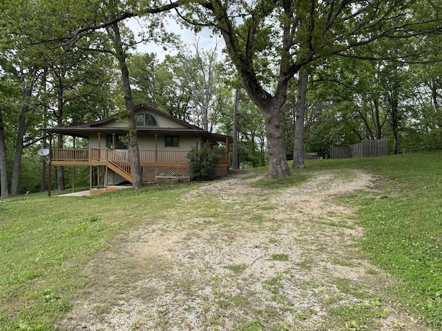 16709 Honeysuckle Hill Rd, Eminence, MO 65466 - view of yard with dirt driveway and covered porch