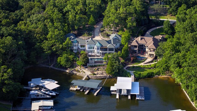 1208 Brookhaven Ln, Sunrise Beach, MO 65079 - bird's eye view of a large body of water and a heavily wooded area