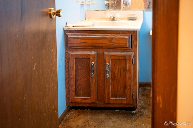 bathroom view of vanity and baseboards