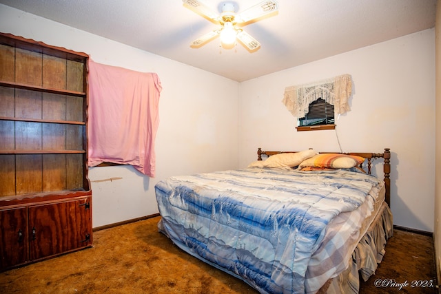 carpeted bedroom with baseboards and a ceiling fan