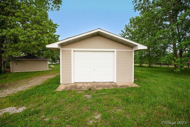 detached garage featuring driveway