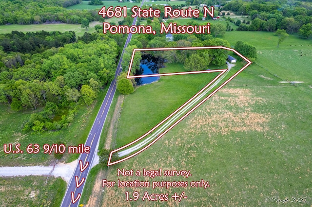 aerial view of property and surrounding area with property parcel outlined