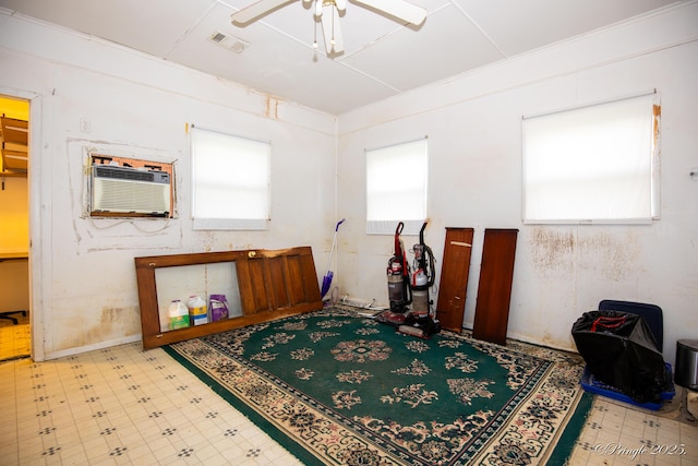 rec room featuring healthy amount of natural light, ceiling fan, tile patterned floors, and a wall mounted air conditioner