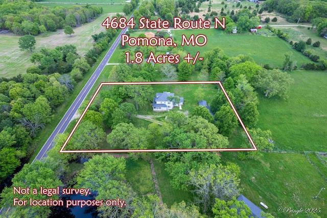 aerial view of sparsely populated area featuring property boundaries highlighted