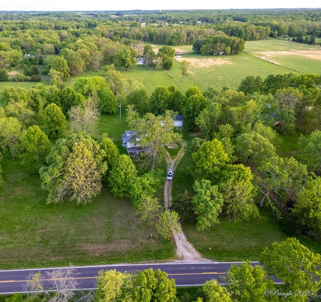 aerial view of property and surrounding area featuring rural landscape