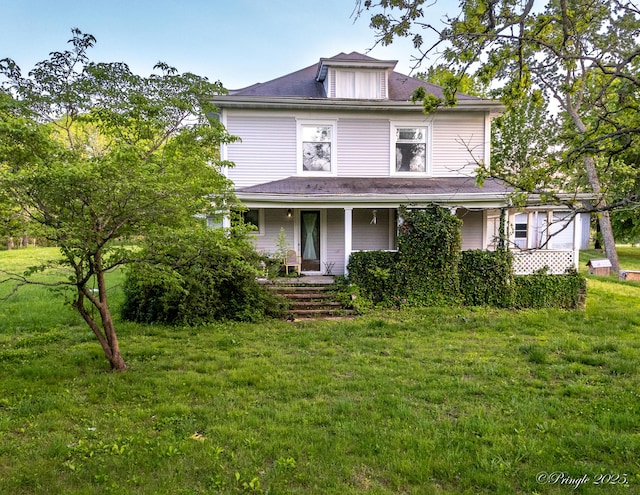 view of front facade with covered porch and a front lawn