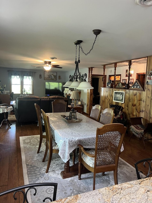 dining room with hardwood / wood-style floors and a ceiling fan