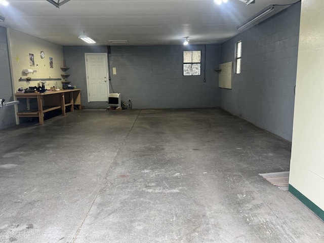 908 N Lincoln, Neosho, MO 64850 - garage with concrete block wall and a workshop area