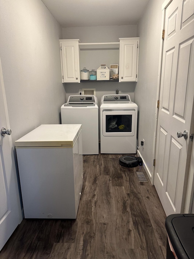 313 Washington St, Mountain View, MO 65548 - laundry room featuring separate washer and dryer, cabinet space, and dark wood-type flooring