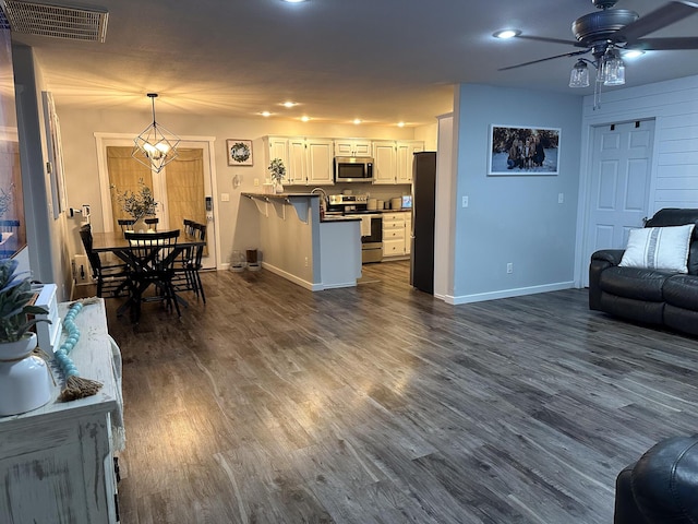 313 Washington St, Mountain View, MO 65548 - kitchen featuring stainless steel appliances, open floor plan, a peninsula, a ceiling fan, and recessed lighting