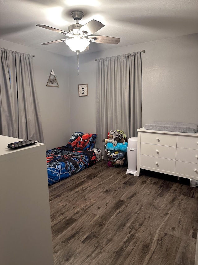 313 Washington St, Mountain View, MO 65548 - bedroom with dark wood-type flooring and ceiling fan