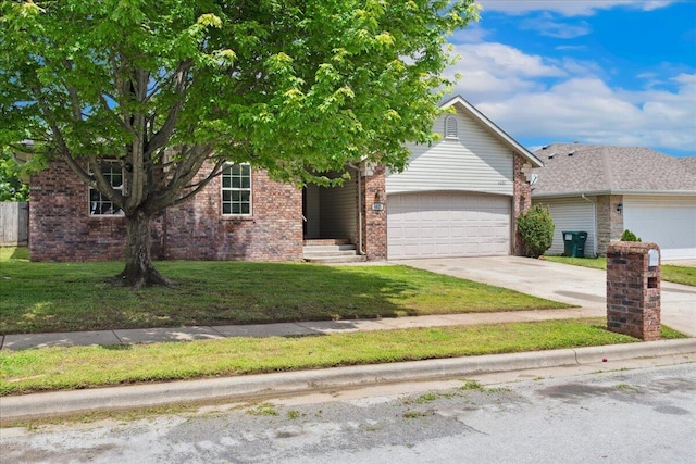 view of property hidden behind natural elements featuring an attached garage, concrete driveway, brick siding, and a front yard