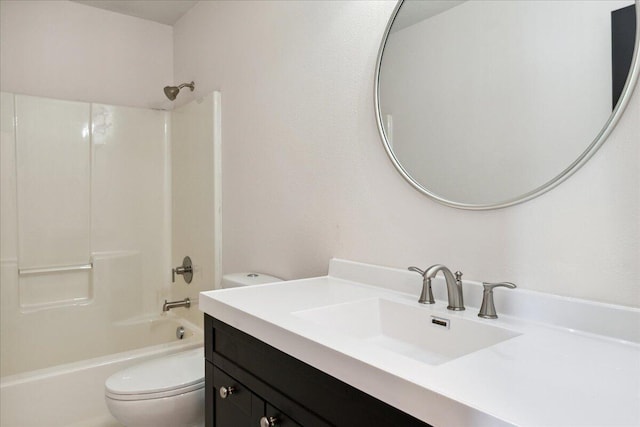 bathroom with toilet, washtub / shower combination, and vanity