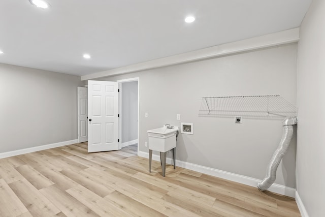 laundry room featuring electric dryer hookup, hookup for a washing machine, recessed lighting, light wood-style floors, and baseboards