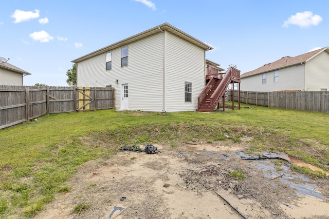 back of property with stairs and a deck