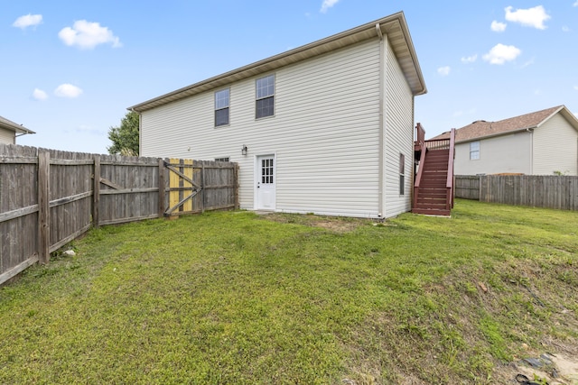 back of house with stairs
