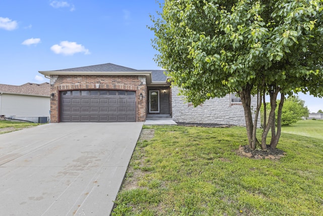 view of front of home featuring an attached garage, a front lawn, concrete driveway, brick siding, and a shingled roof