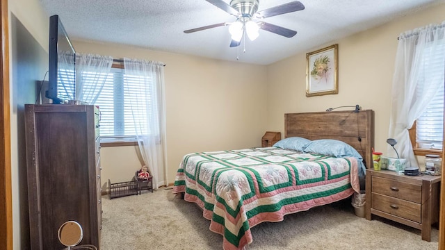 920 Oak St, Thayer, MO 65791 - carpeted bedroom featuring a ceiling fan and a textured ceiling