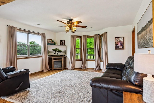 1215 E 515th Rd, Morrisville, MO 65710 - living room featuring ceiling fan and wood finished floors