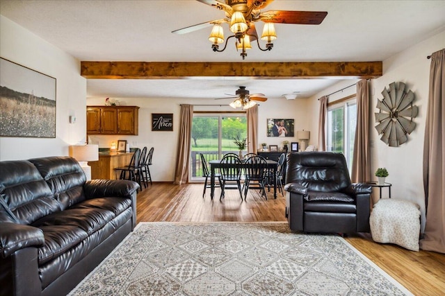 1215 E 515th Rd, Morrisville, MO 65710 - living area with ceiling fan, beamed ceiling, and wood finished floors