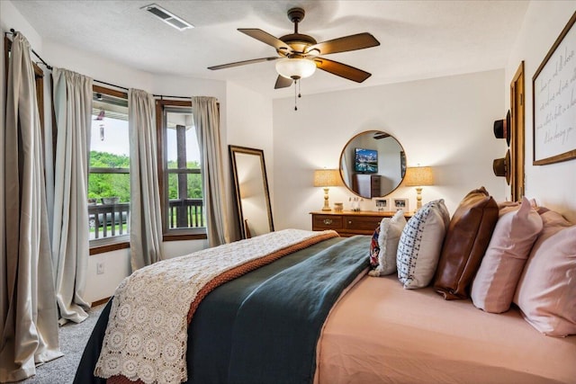 1215 E 515th Rd, Morrisville, MO 65710 - carpeted bedroom with a ceiling fan