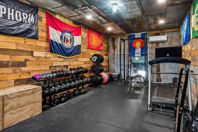 1215 E 515th Rd, Morrisville, MO 65710 - workout area with wood walls and a wall mounted AC