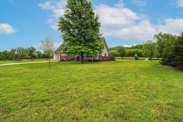 1215 E 515th Rd, Morrisville, MO 65710 - view of grassy yard featuring a playground and a deck