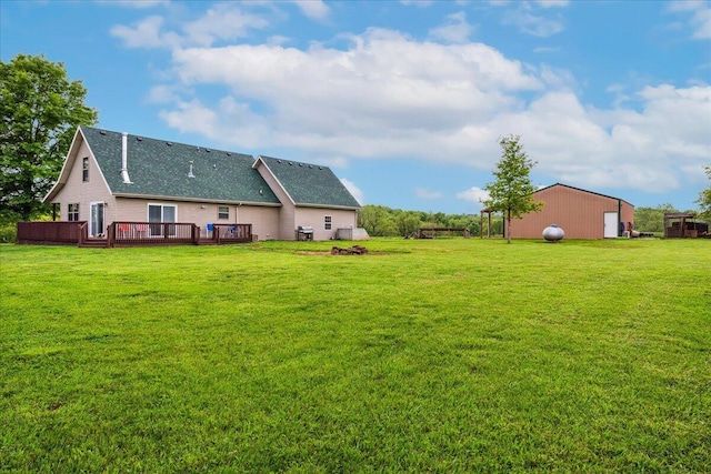 1215 E 515th Rd, Morrisville, MO 65710 - rear view of house with a shingled roof, a lawn, and a deck