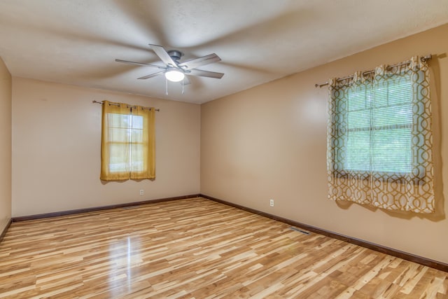 713 Taneycomo Rd, Branson, MO 65616 - spare room with ceiling fan, light wood-type flooring, and baseboards