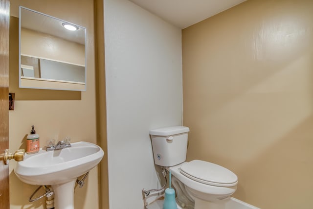 713 Taneycomo Rd, Branson, MO 65616 - half bathroom with toilet and a sink