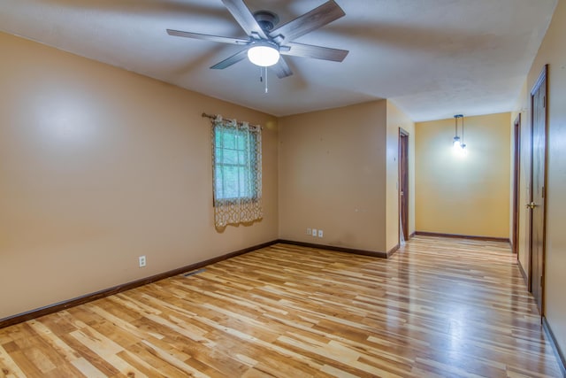 713 Taneycomo Rd, Branson, MO 65616 - empty room featuring light wood-type flooring, ceiling fan, and baseboards