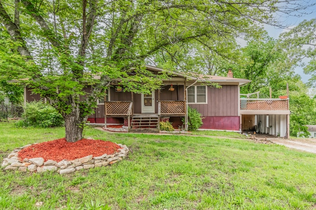 713 Taneycomo Rd, Branson, MO 65616 - view of front of home with a porch, a front lawn, and a chimney