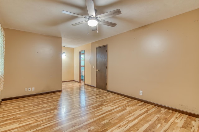 713 Taneycomo Rd, Branson, MO 65616 - spare room featuring light wood finished floors, a ceiling fan, and baseboards