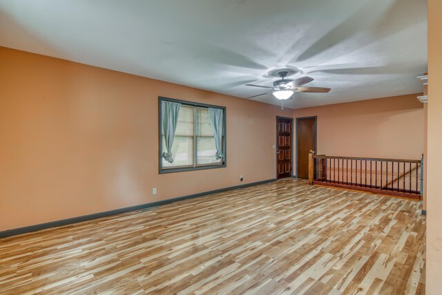 713 Taneycomo Rd, Branson, MO 65616 - spare room with light wood-style flooring, ceiling fan, and baseboards