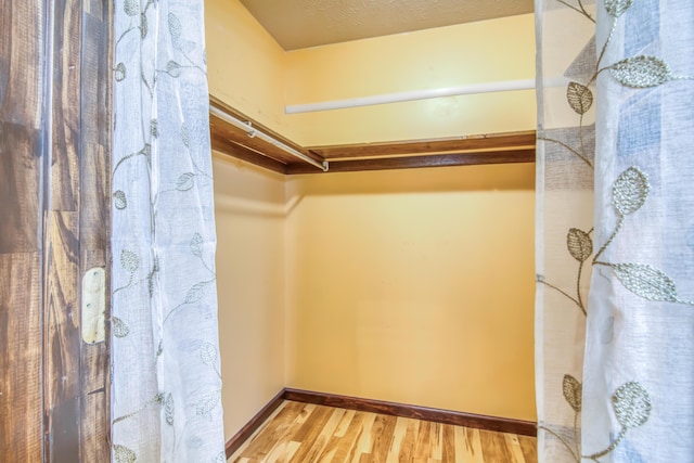713 Taneycomo Rd, Branson, MO 65616 - walk in closet with wood finished floors