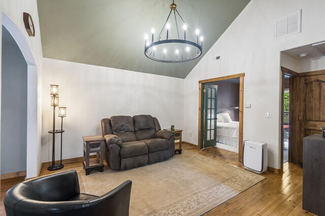 1226 Peace In Valley Rd, Blue Eye, MO 65611 - living area with high vaulted ceiling, wood finished floors, a chandelier, and baseboards