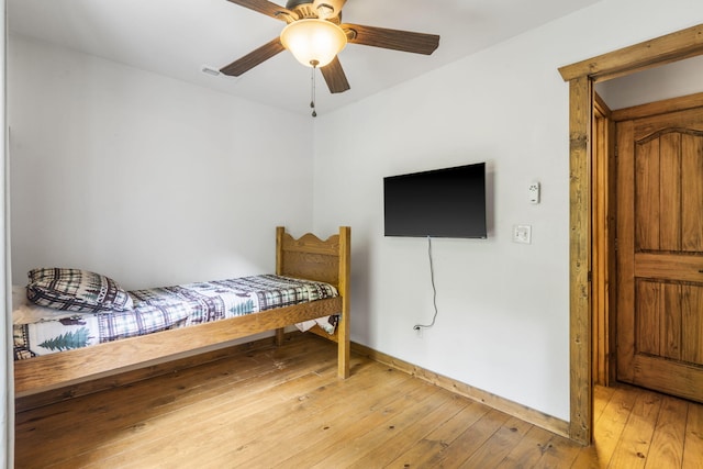 1226 Peace In Valley Rd, Blue Eye, MO 65611 - bedroom with light wood-type flooring, baseboards, and ceiling fan