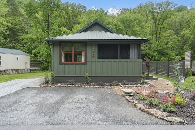 1226 Peace In Valley Rd, Blue Eye, MO 65611 - view of outbuilding with fence and a forest view