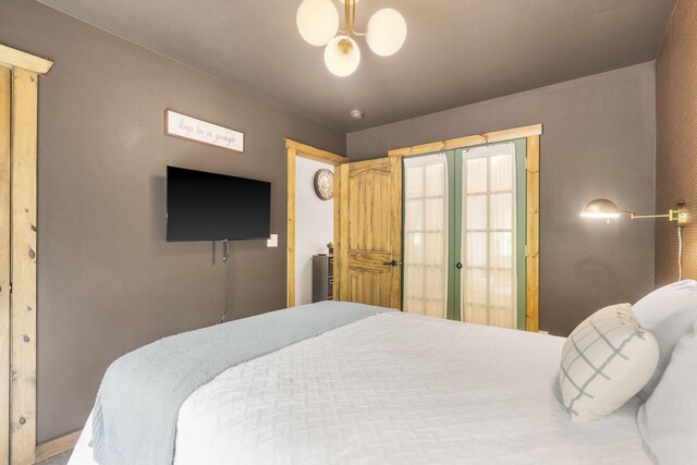 1226 Peace In Valley Rd, Blue Eye, MO 65611 - bedroom featuring a chandelier