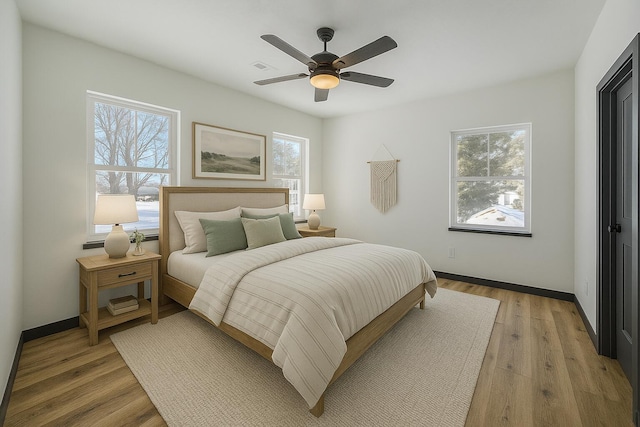 834 Morris St, Mountain Grove, MO 65711 - bedroom featuring light wood-type flooring, baseboards, and ceiling fan