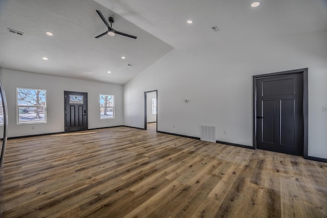 834 Morris St, Mountain Grove, MO 65711 - unfurnished living room featuring a ceiling fan, high vaulted ceiling, recessed lighting, wood finished floors, and baseboards