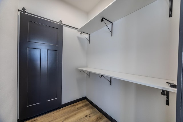 834 Morris St, Mountain Grove, MO 65711 - spacious closet featuring light wood-type flooring and a barn door