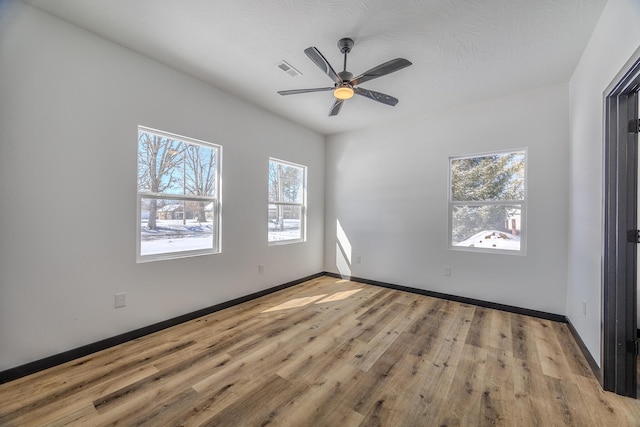 834 Morris St, Mountain Grove, MO 65711 - empty room featuring wood finished floors, baseboards, and a ceiling fan