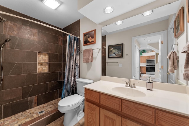 351 Wildwood Dr S Unit 5, Branson, MO 65616 - bathroom with a tile shower, toilet, vanity, and recessed lighting