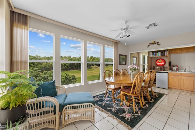 351 Wildwood Dr S Unit 5, Branson, MO 65616 - dining area featuring light tile patterned floors, a ceiling fan, and bar